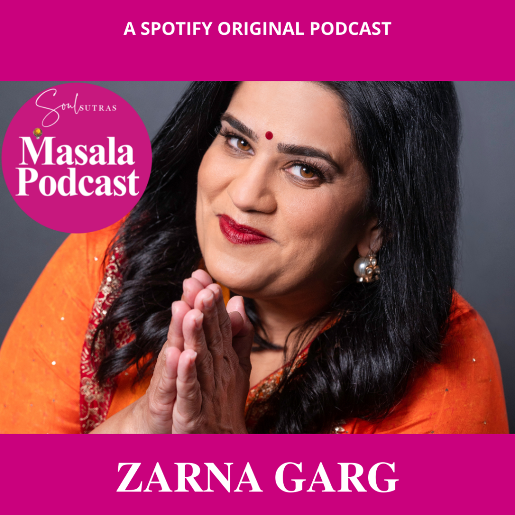 Zarna Garg US Indian comedian on Masala Podcast looks into camera with her hands folded Indian style